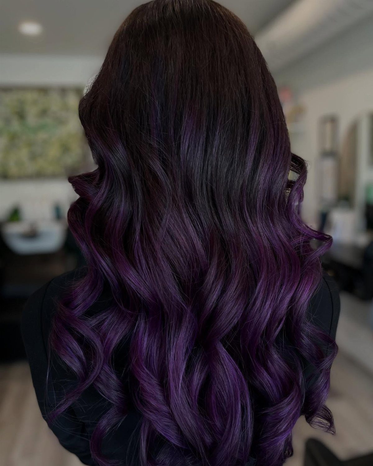 Long wavy hair with a gradient from dark burgundy to vibrant violet purple.